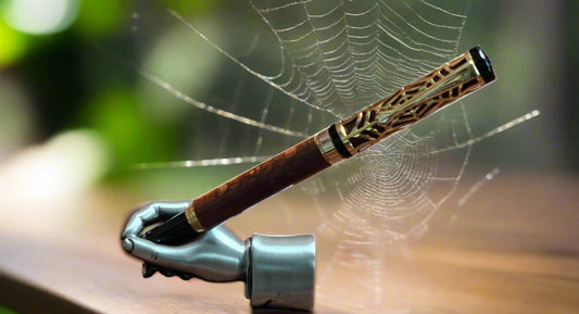 Pen: Lacewood Capped Pen with a Golden Spider Web overlay and a Gold and Black Chrome Pen Kit