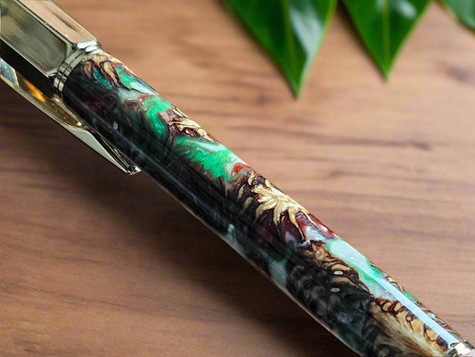 Pen: Hexagonal Christmas Colors Vertex Click Pen with Pinecones Swirled in Holiday Resin and Accompanied by a Gold Pen Kit